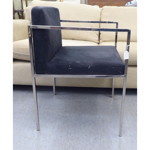 79 - A Kesterport chromium plated framed open arm desk chair, raised on square legs