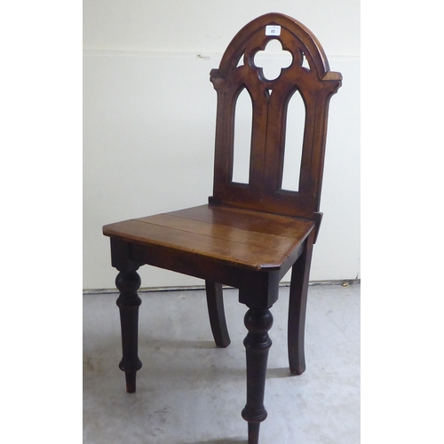 80 - Five items of 19thC and later small furniture: to include a mahogany framed ecclesiastical style hal... 