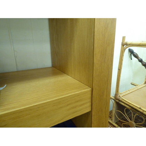 85 - A modern light oak finished four tier open bookcase, on a plinth  71