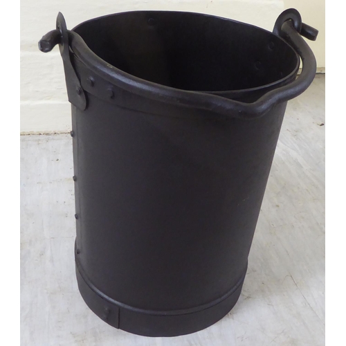 119 - A rivetted cast metal cylindrical bucket