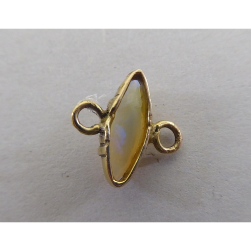 124 - A yellow metal pendant, set with a central opal, featuring a floral motif  stamped 9ct