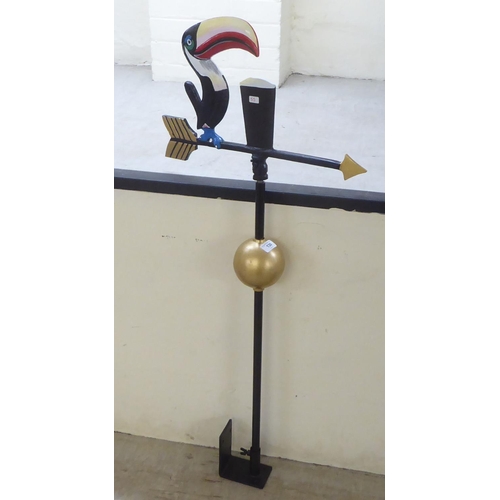 130 - A modern painted, cast iron weather vane, surmounted by a Guinness Toucan