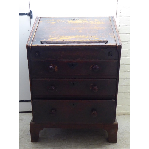 142 - A 19thC painted pine bureau with a hinged lid, over three graduated drawers, raised on bracket feet&... 