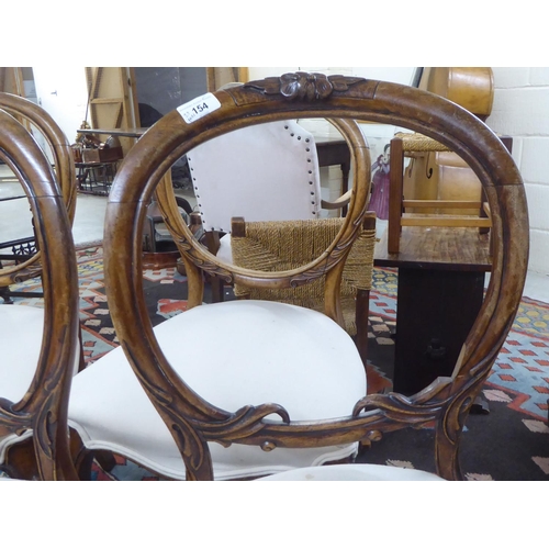 154 - Two similar pairs of late 19thC mahogany framed open back dining chairs, the later fabric covered se... 