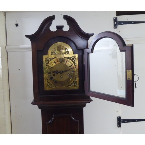 157 - A modern mahogany cased granddaughter clock; the movement faced by a Roman dial  69