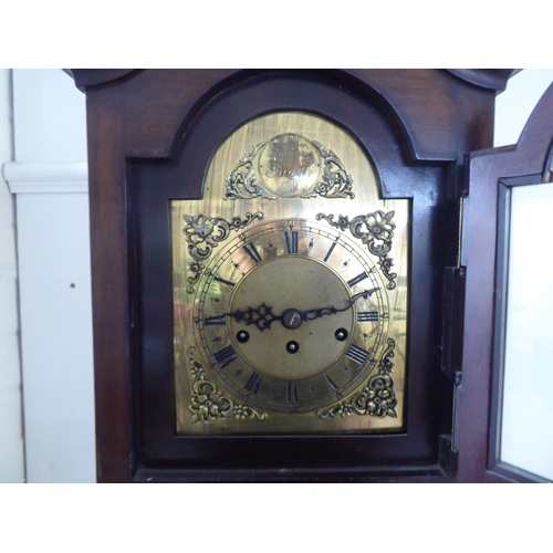 157 - A modern mahogany cased granddaughter clock; the movement faced by a Roman dial  69