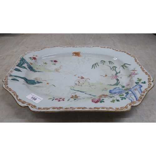 158 - An 18thC Chinese porcelain meat plate, decorated with a landscape  17