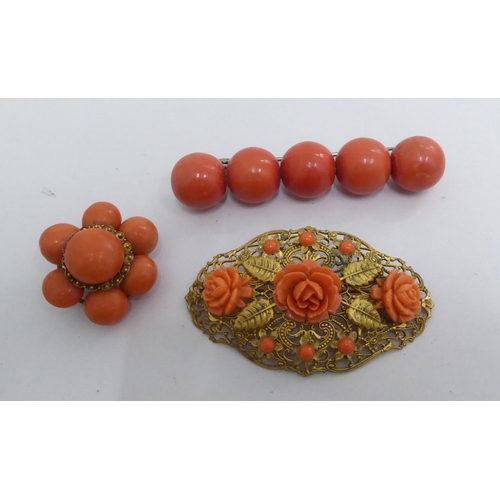 16 - Coral coloured, turned and finished items of personal ornament