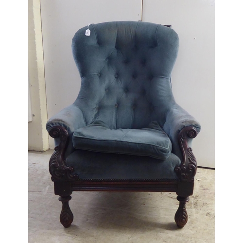 162 - A mid Victorian mahogany showwood framed salon chair, later part button upholstered in blue fabric, ... 