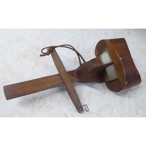 188 - An early 20thC stereoscopic viewer; and viewing cards