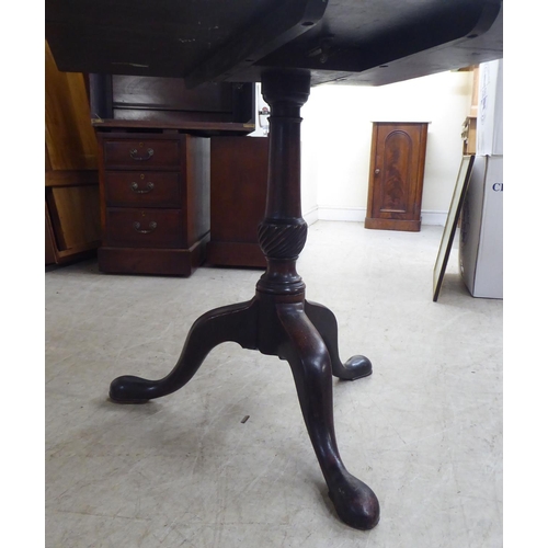 193 - A late 19thC mahogany (marriage) pedestal table, the top raised on a turned column and tripod base  ... 