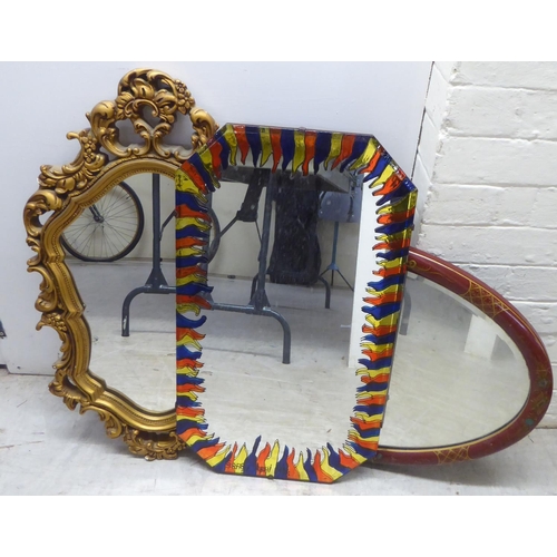 198 - Mirrors: to include a mid 20thC Japanese inspired red painted and gilt framed example  19