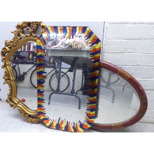 198 - Mirrors: to include a mid 20thC Japanese inspired red painted and gilt framed example  19