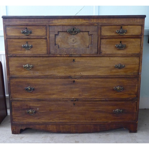 209 - A George III string inlaid mahogany eight drawer dressing chest, raised on bracket feet  44