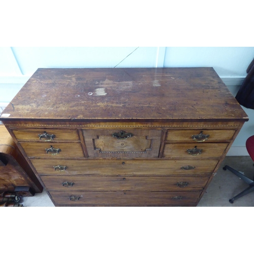 209 - A George III string inlaid mahogany eight drawer dressing chest, raised on bracket feet  44