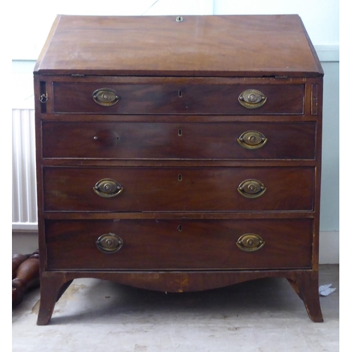 220 - A George III mahogany bureau with a fall flap, over four graduated drawers, raised on bracket feet&n... 