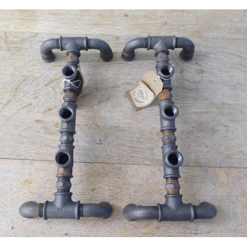 224 - Interior design accessories: to include novelty candle stands, fashioned as pipework by Corpo Sancto... 