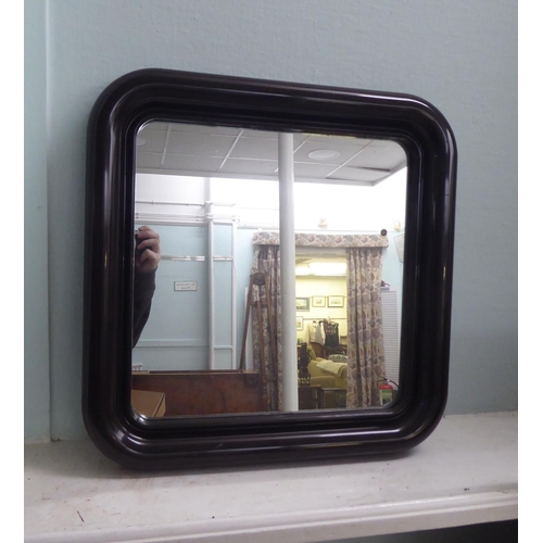 225 - Four 20thC mirrors: to include a 1970s teak framed example  48