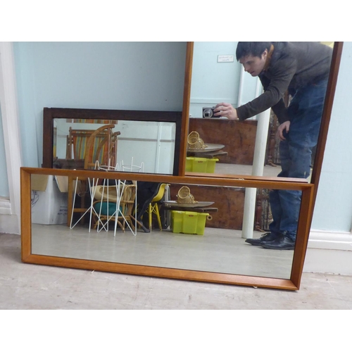 225 - Four 20thC mirrors: to include a 1970s teak framed example  48