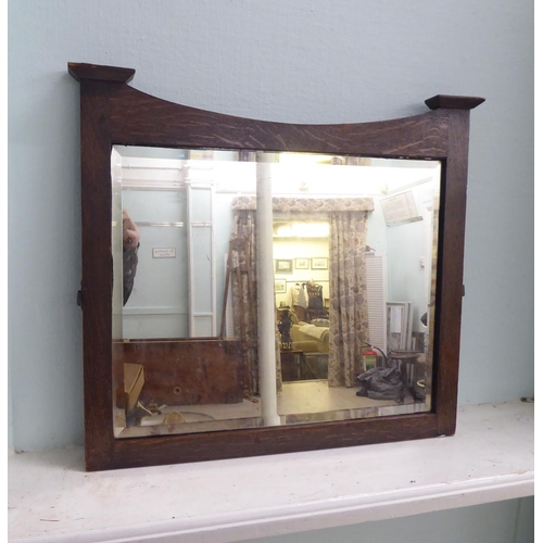 225 - Four 20thC mirrors: to include a 1970s teak framed example  48