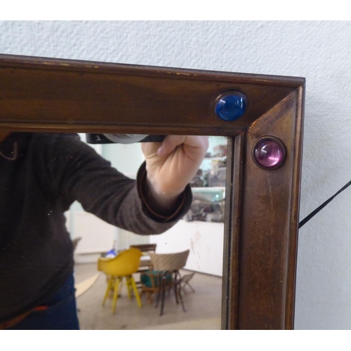 236 - A 19thC mirror, the plate set in a mitred brass frame, decorated with multi-coloured glass beads  20... 