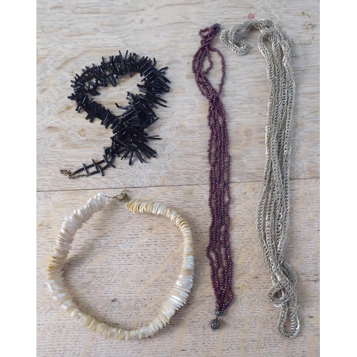 242 - Costume jewellery: to include black coral bangles and necklaces 