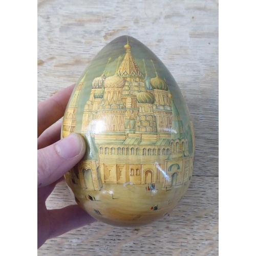 246 - A Russian hand painted egg  bears a signature  5