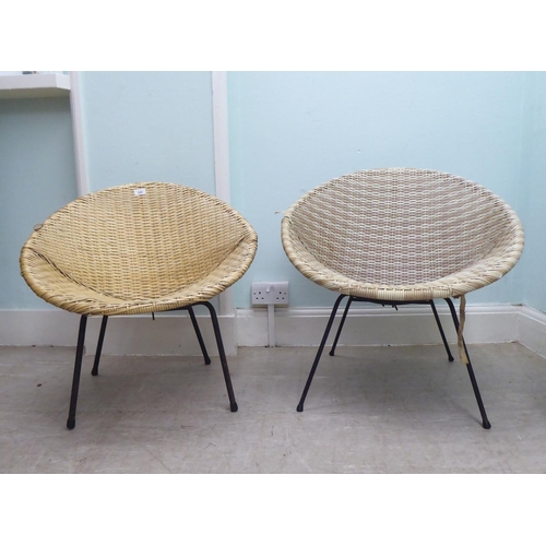 248 - A pair of vintage rubberised cane work effect chairs, raised on cast metal legs