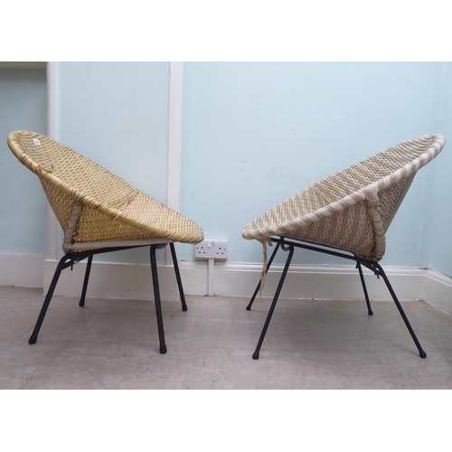 248 - A pair of vintage rubberised cane work effect chairs, raised on cast metal legs