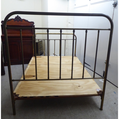 253 - An early 20thC lacquered brass single bed frames, the headboard 48