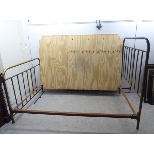 253 - An early 20thC lacquered brass single bed frames, the headboard 48