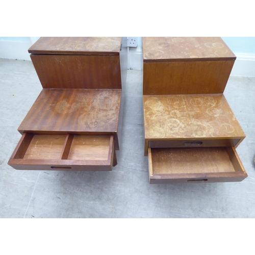 260 - A pair of 1970s teak tables of staggered form with hinged lids and drawer compartments  17