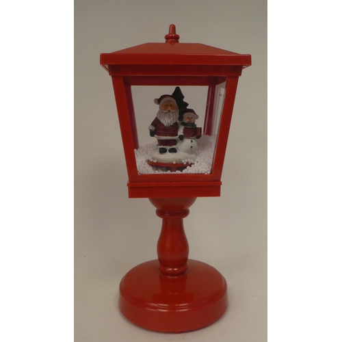 267 - An electric musical snow lantern with Santa  15