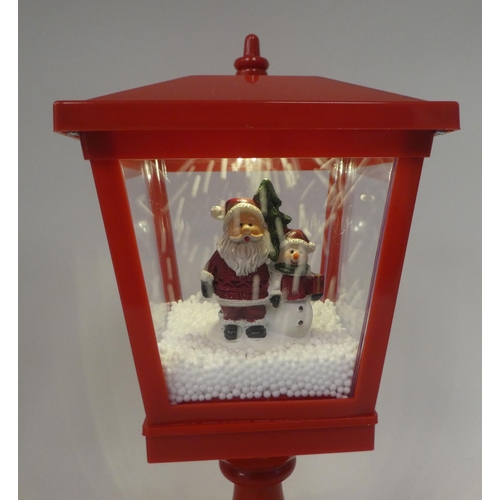 267 - An electric musical snow lantern with Santa  15