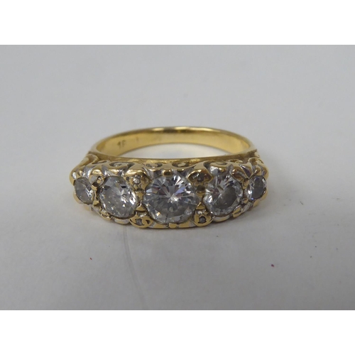 275 - A late Victorian yellow metal ring, set with five graduated diamonds  stamped 18ct 