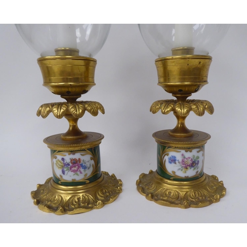 284 - A pair of modern antique French reproduction porcelain cast gilt brass and glazed candlesticks  13.5... 