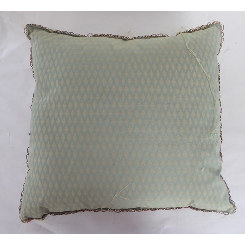 290 - A 20thC foliate patterned embroidered scatter cushion with coloured threads