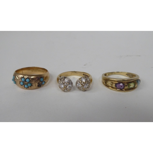 294 - Three 9ct gold rings, one set with a band of multi-coloured stones 