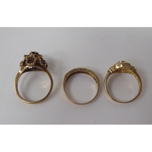 299 - Three 9ct gold rings, one set with alternating diamonds and rubies 