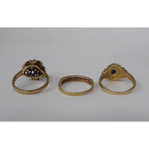 299 - Three 9ct gold rings, one set with alternating diamonds and rubies 