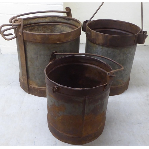 30 - A set of three galvanised metal buckets with swing handles