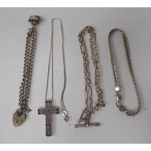 300 - Silver and white metal jewellery: to include a charm bracelet; and various broochs 