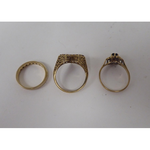 306 - Three 9ct gold rings, one with purple stones, fashioned as a heart