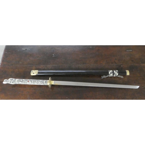 312 - A reproduction Japanese Samurai sword with a composition handle  the blade 29