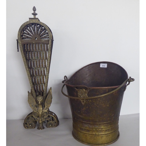 313 - 19th/20thC decorative and functional metalware: to include a Georgian design, peacock feather firesc... 