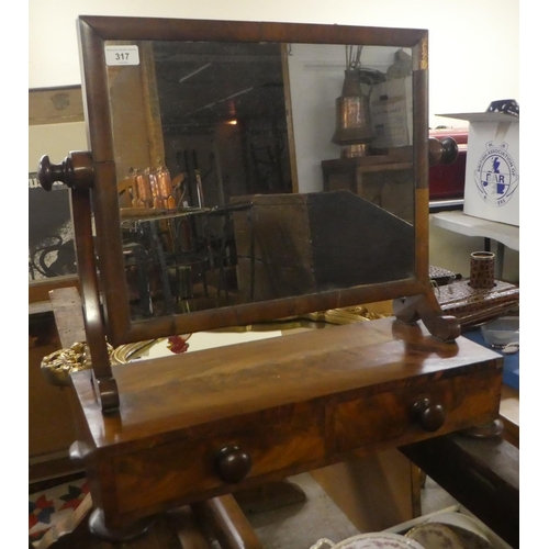 317 - A 19thC mahogany veneered dressing table mirror, the plate on splayed pivoting horns, over two drawe... 