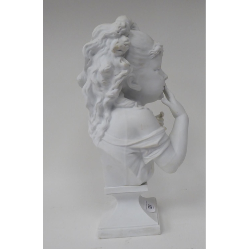 320 - An early 20thC white glazed porcelain bust, a young girl  15