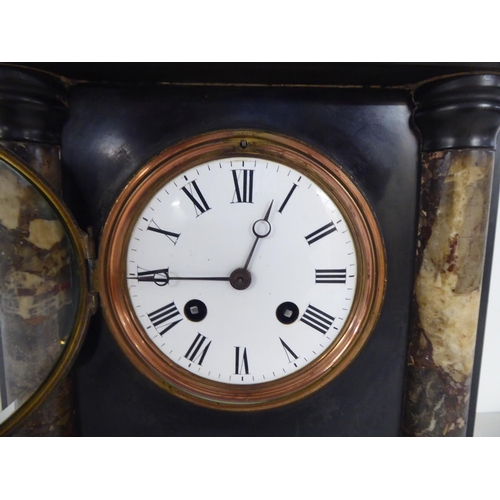 324 - A late Victorian black slate mantel clock of architectural form; the 8 day movement faced by a Roman... 