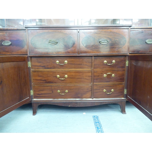 326 - A 19thC mahogany breakfront library bookcase with a blind fret carved cornice, over four ecclesiasti... 