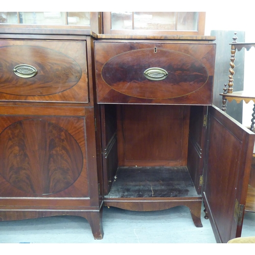 326 - A 19thC mahogany breakfront library bookcase with a blind fret carved cornice, over four ecclesiasti... 